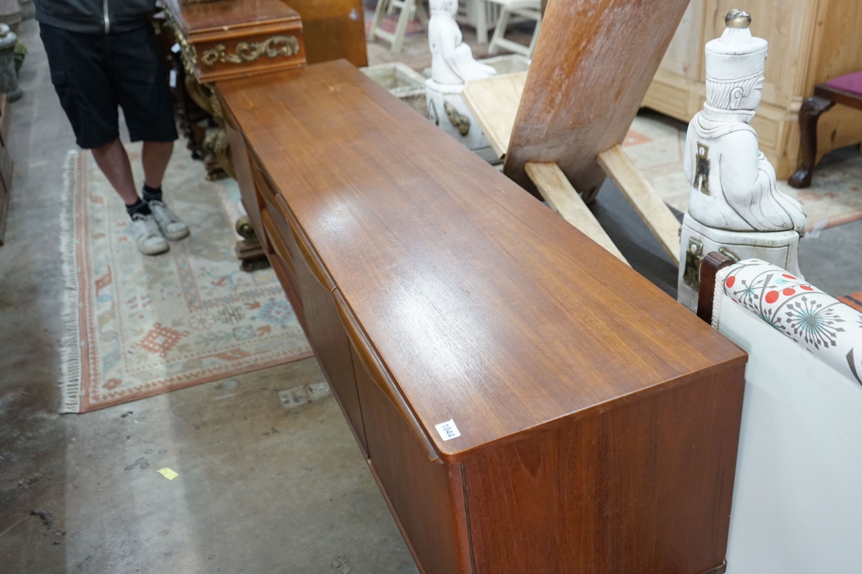 A Stoneleigh mid century teak sideboard, length 198cm, depth 44cm, height 74cm
